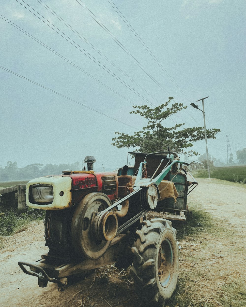 a tractor that is sitting in the dirt