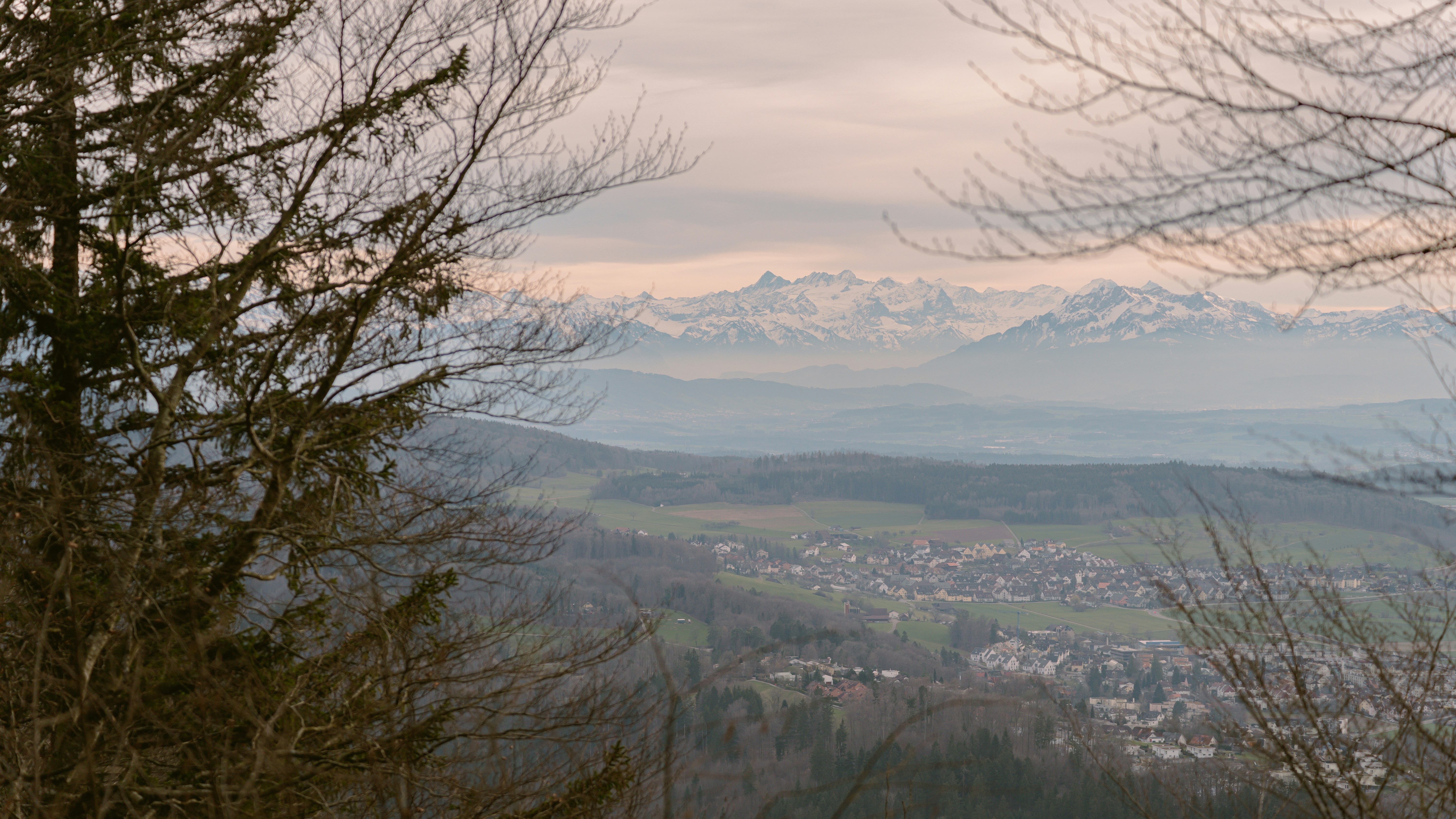 a view of a town and mountains from a distance
