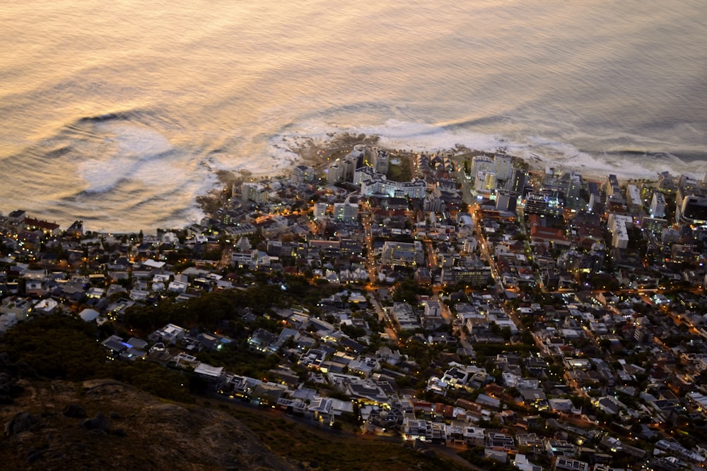 an aerial view of a city by the ocean