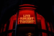 a neon sign that reads live concert tonight