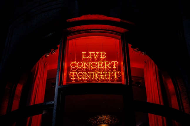 a neon sign that reads live concert tonight