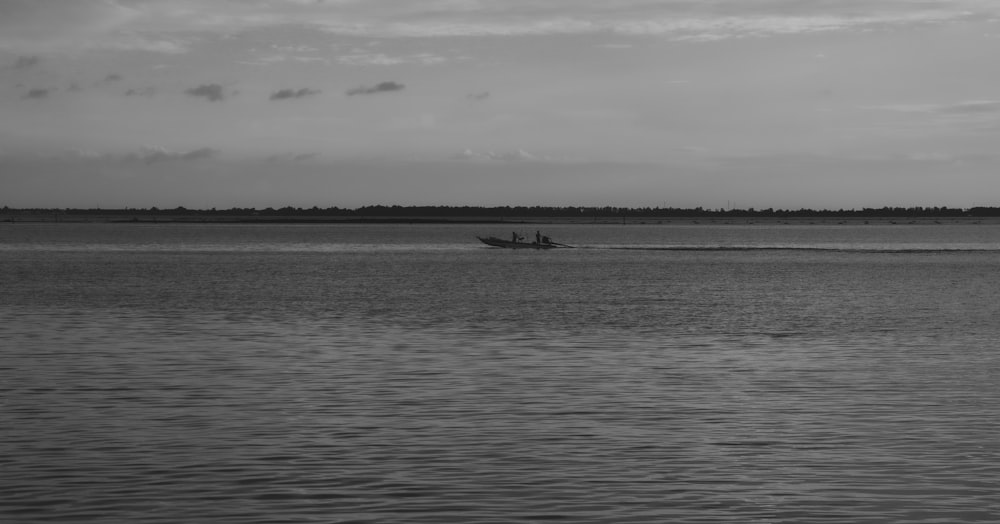 a boat traveling across a large body of water