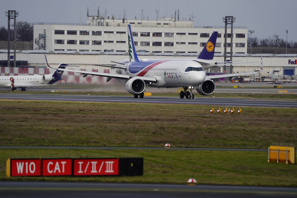 a large jetliner sitting on top of an airport runway