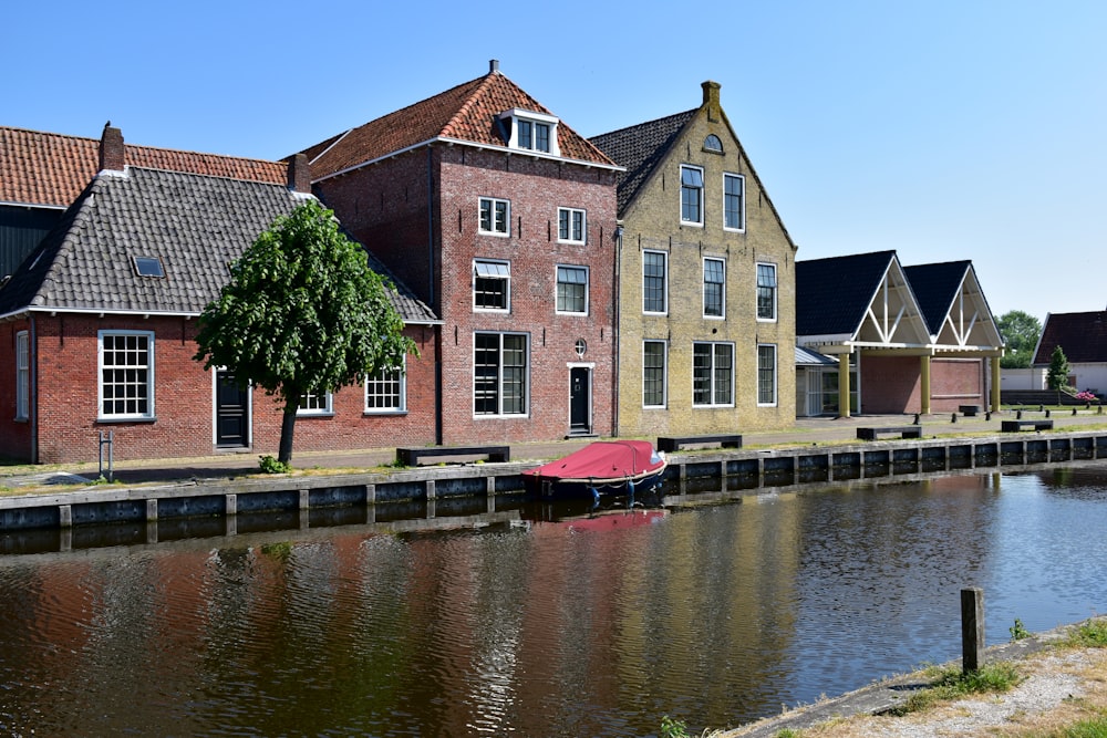 a row of houses next to a body of water