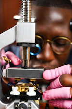 Close-up of hands adjusting a physiotherapy device with precision.