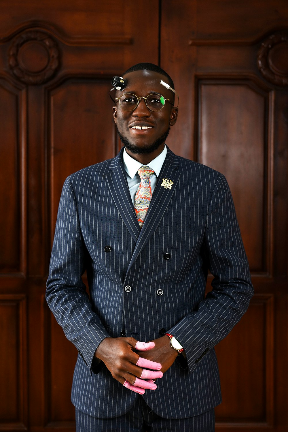 a man in a suit and tie posing for a picture