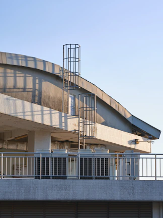 Behind-the-scenes shot of the crew filming a dramatic rooftop confrontation.