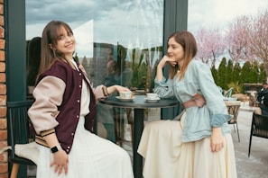 A smiling woman enjoying a casual coffee date outdoors