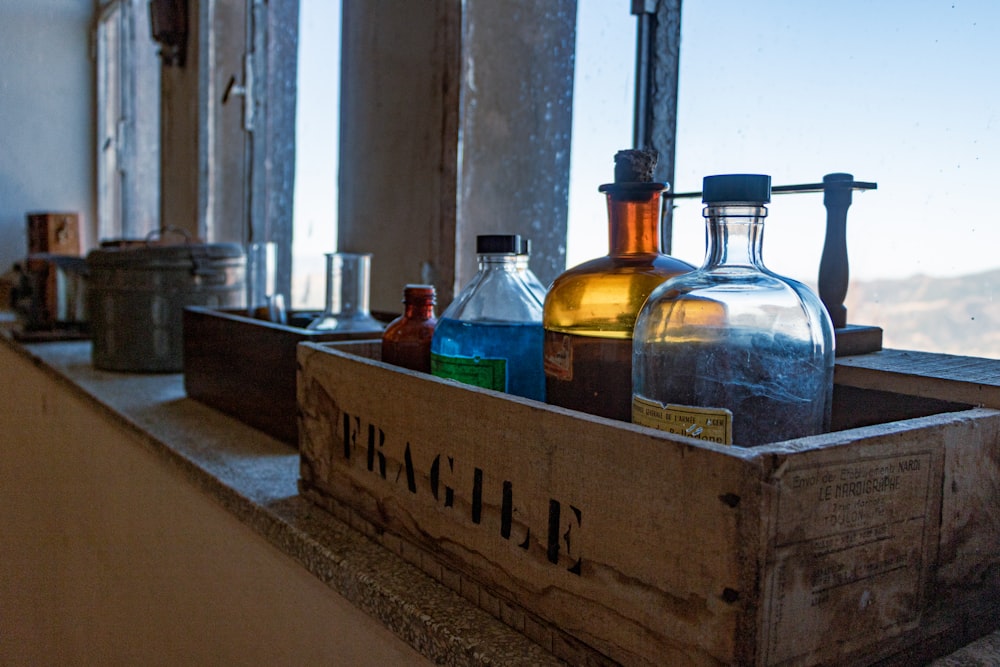 a wooden crate filled with bottles of liquor