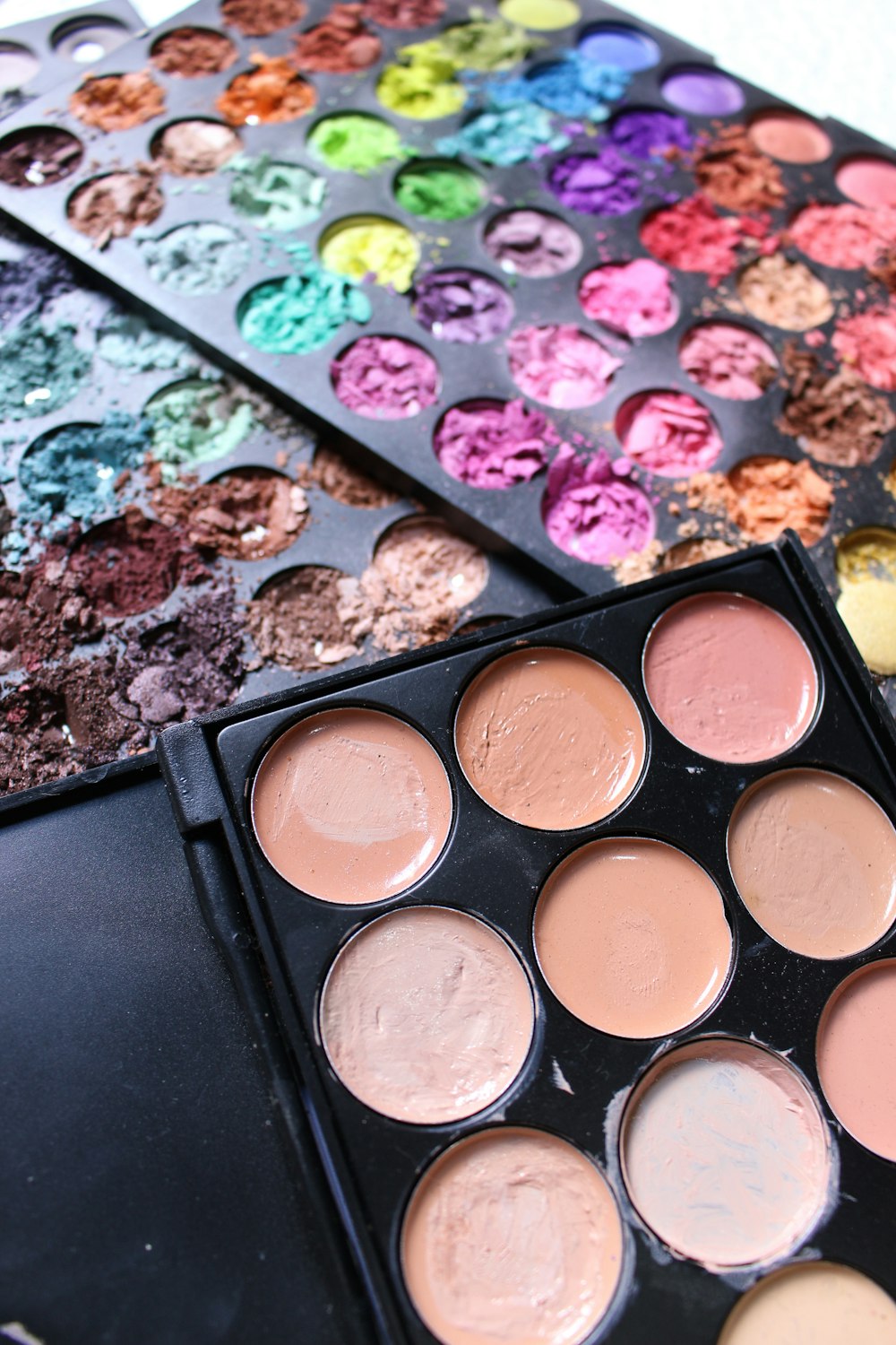 a close up of a palette of makeup on a table