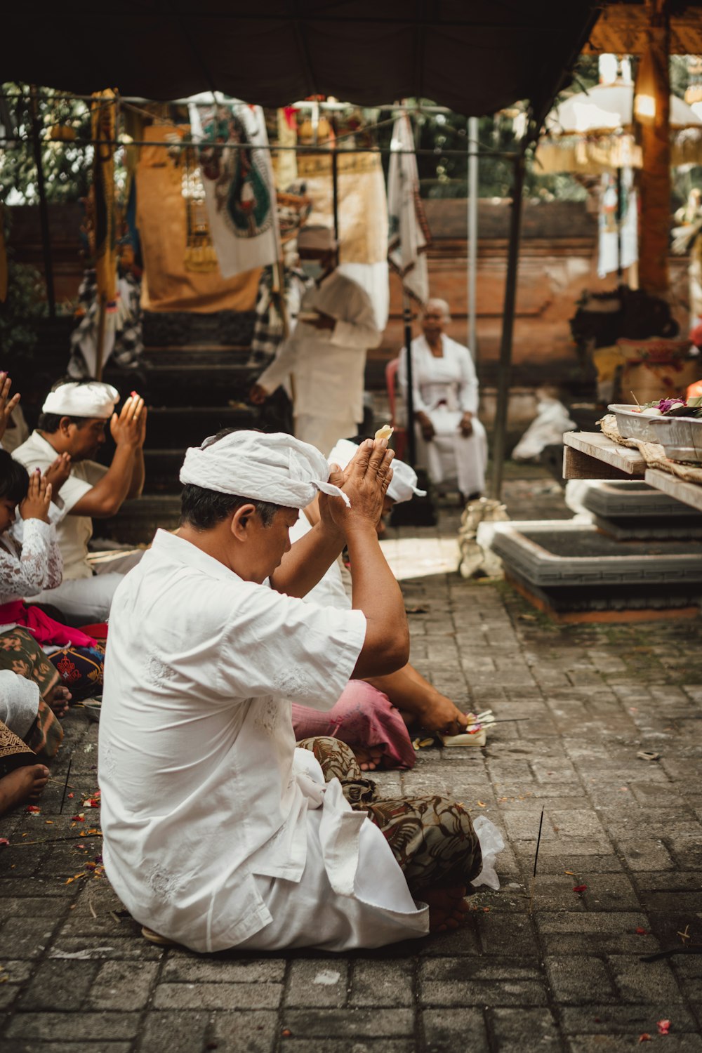 a group of people sitting on the ground