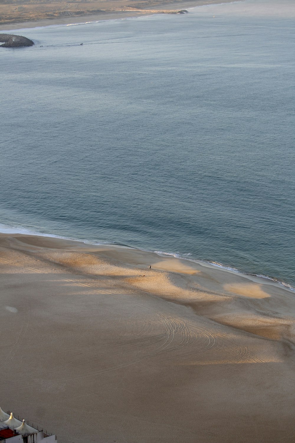 a view of a beach and a body of water