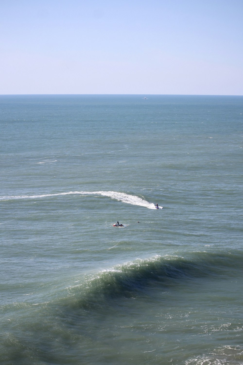 a person riding a surfboard on a wave in the ocean