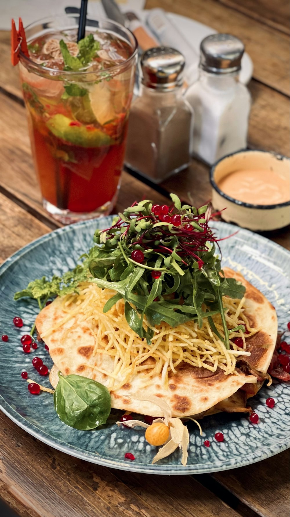 a plate of food on a wooden table