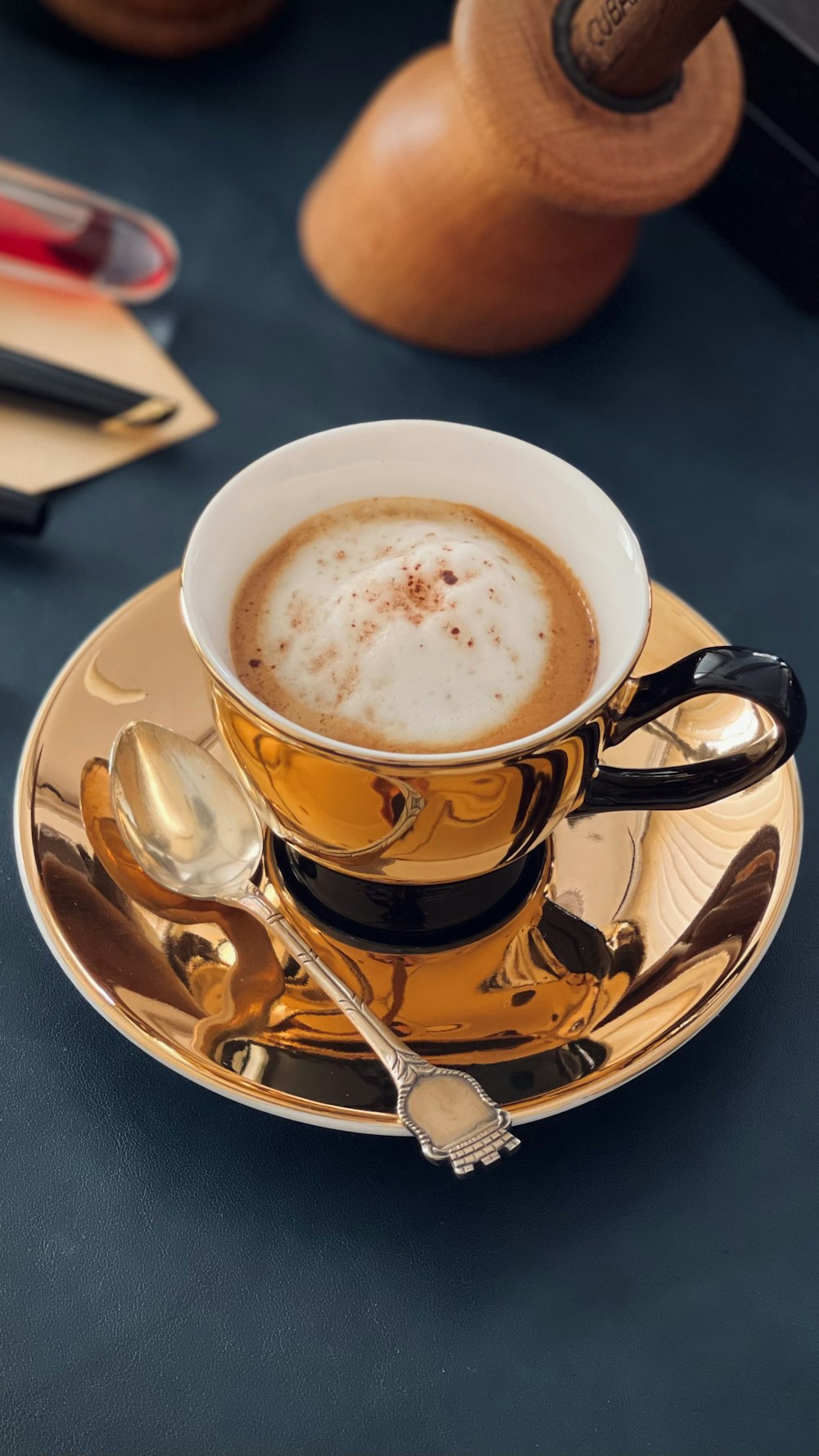 a cup of cappuccino on a saucer