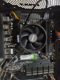 Modern CPU chip resting on a sleek motherboard with green neon highlights.