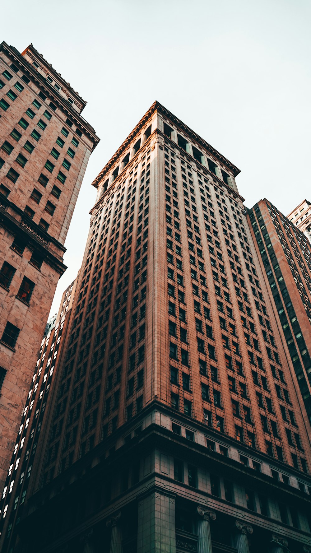 a very tall building towering over a city