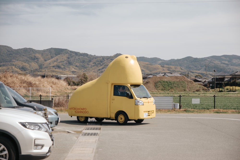 a large yellow truck parked in a parking lot