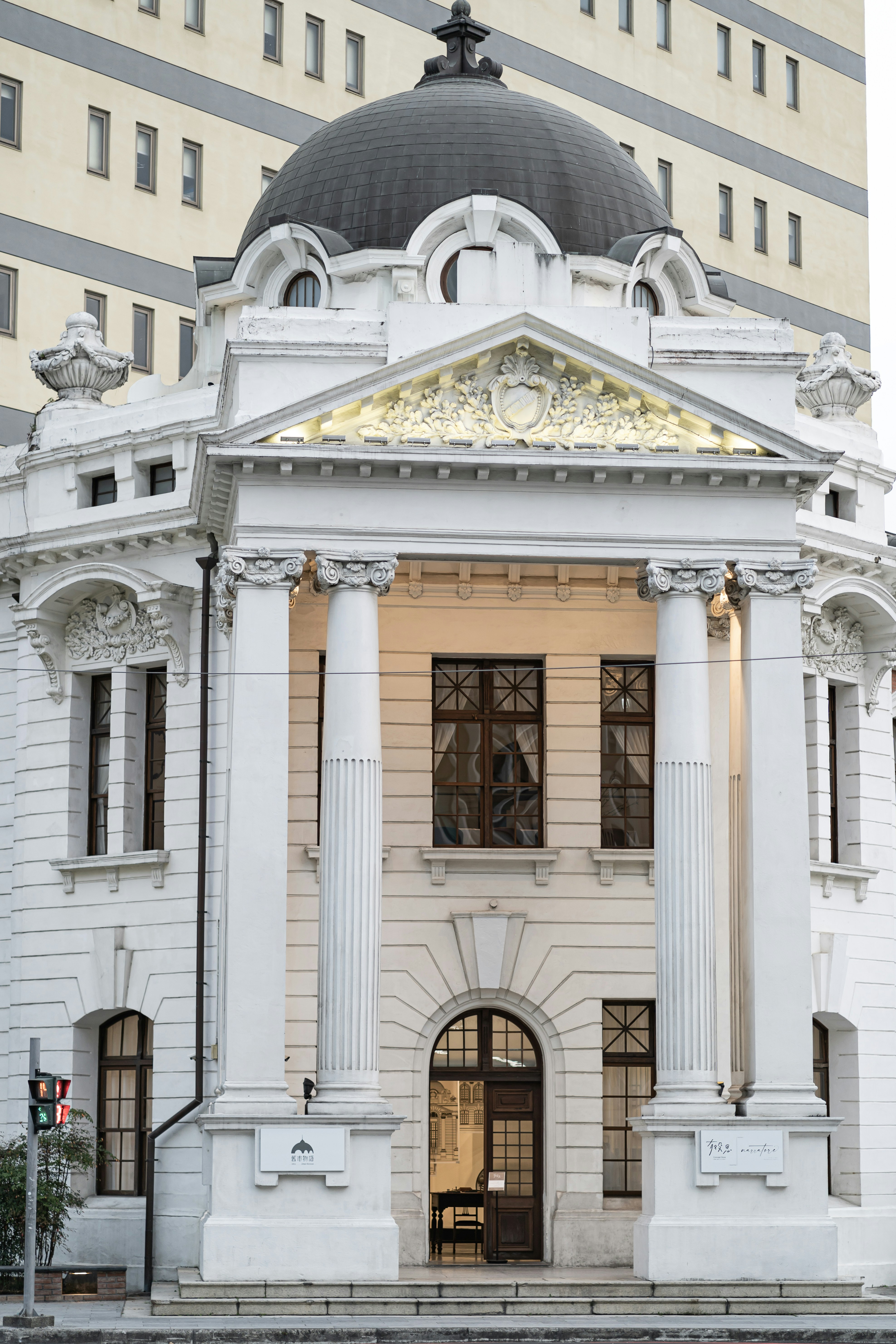 a large white building with columns and a dome