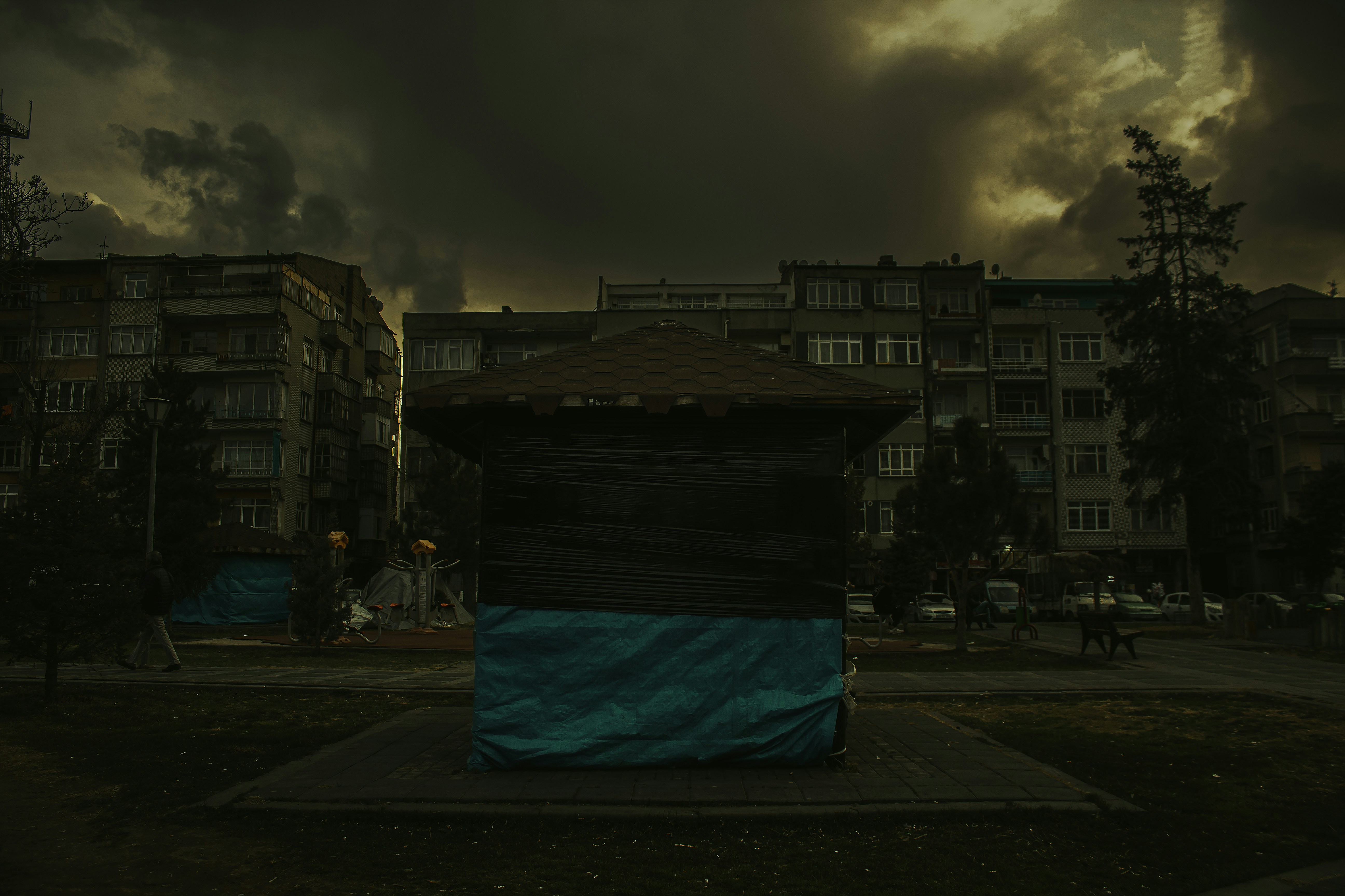 a building with a blue tarp covering it