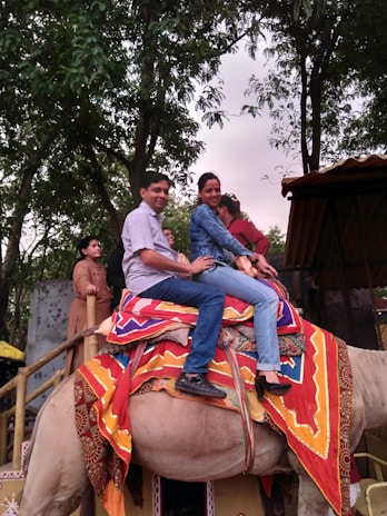 Joyful travelers sharing mint tea and laughter during a cultural tour in Marrakech.