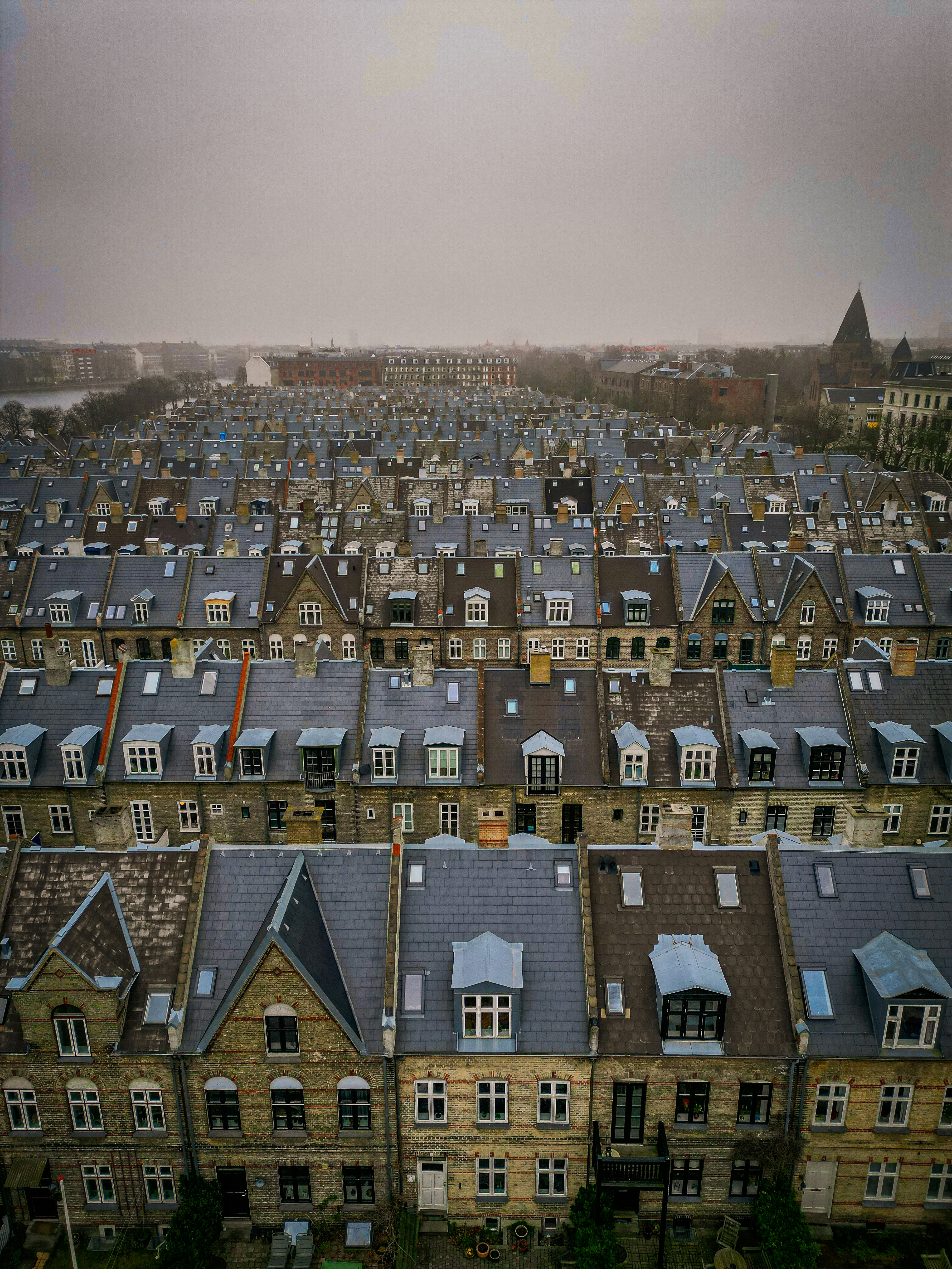 A large group of buildings with a sky background photo – Free Drone ...