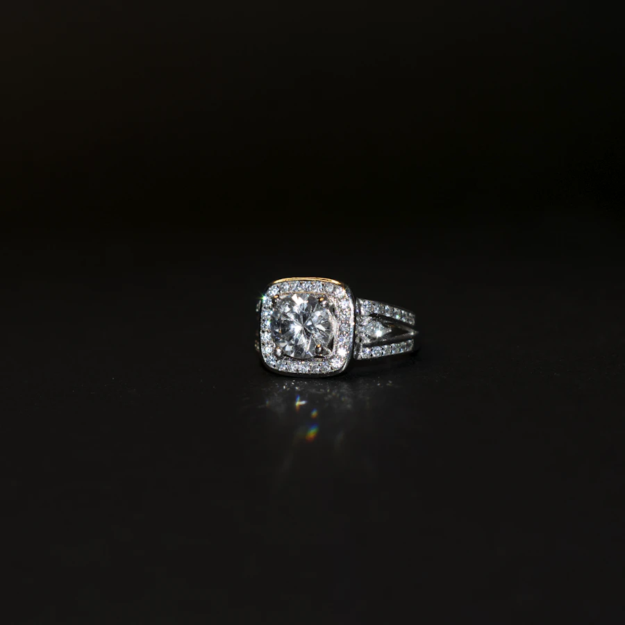 Diamond ring on black surface