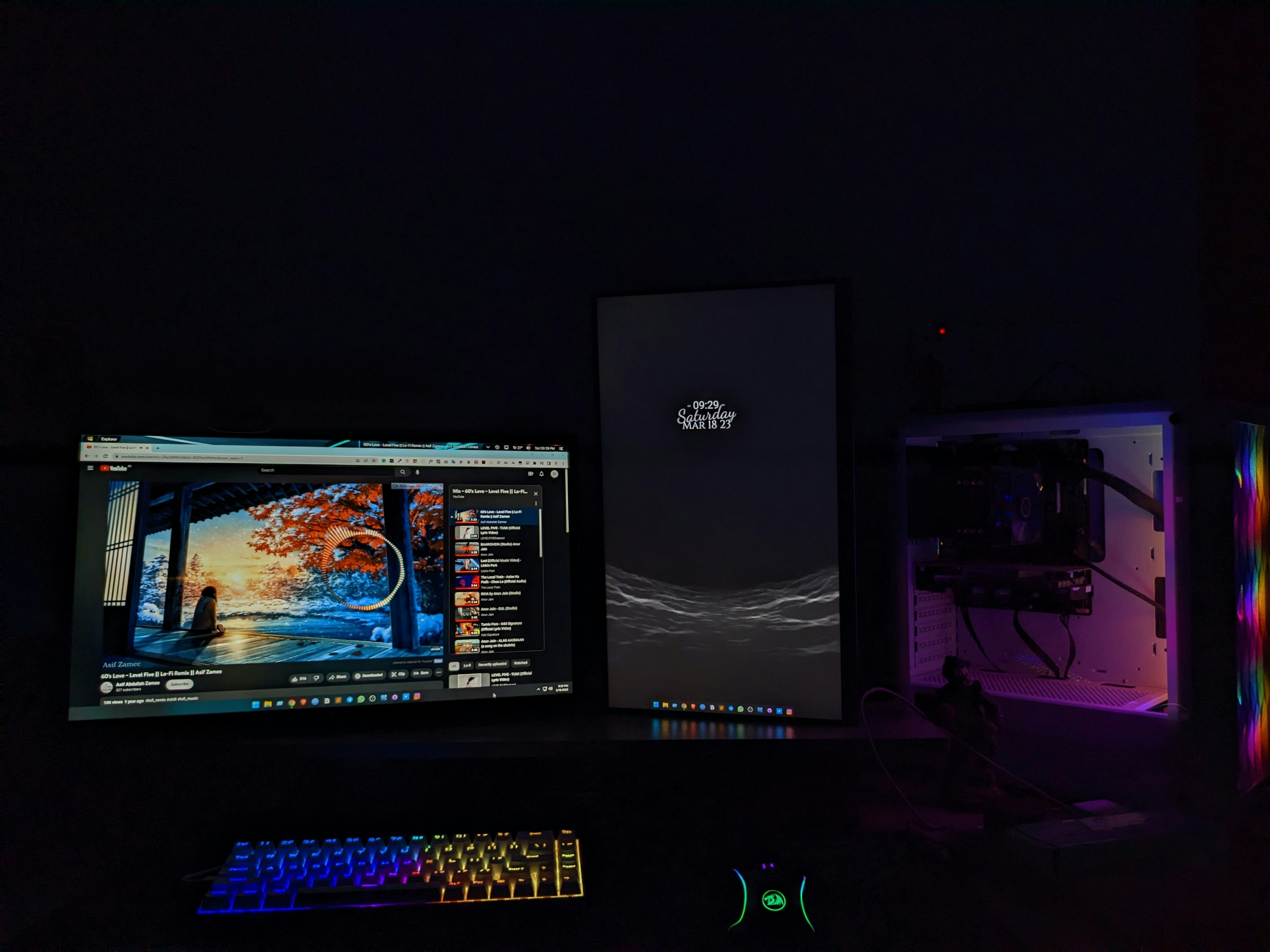 Atmospheric dark gaming room with glowing screens showing game worlds at night