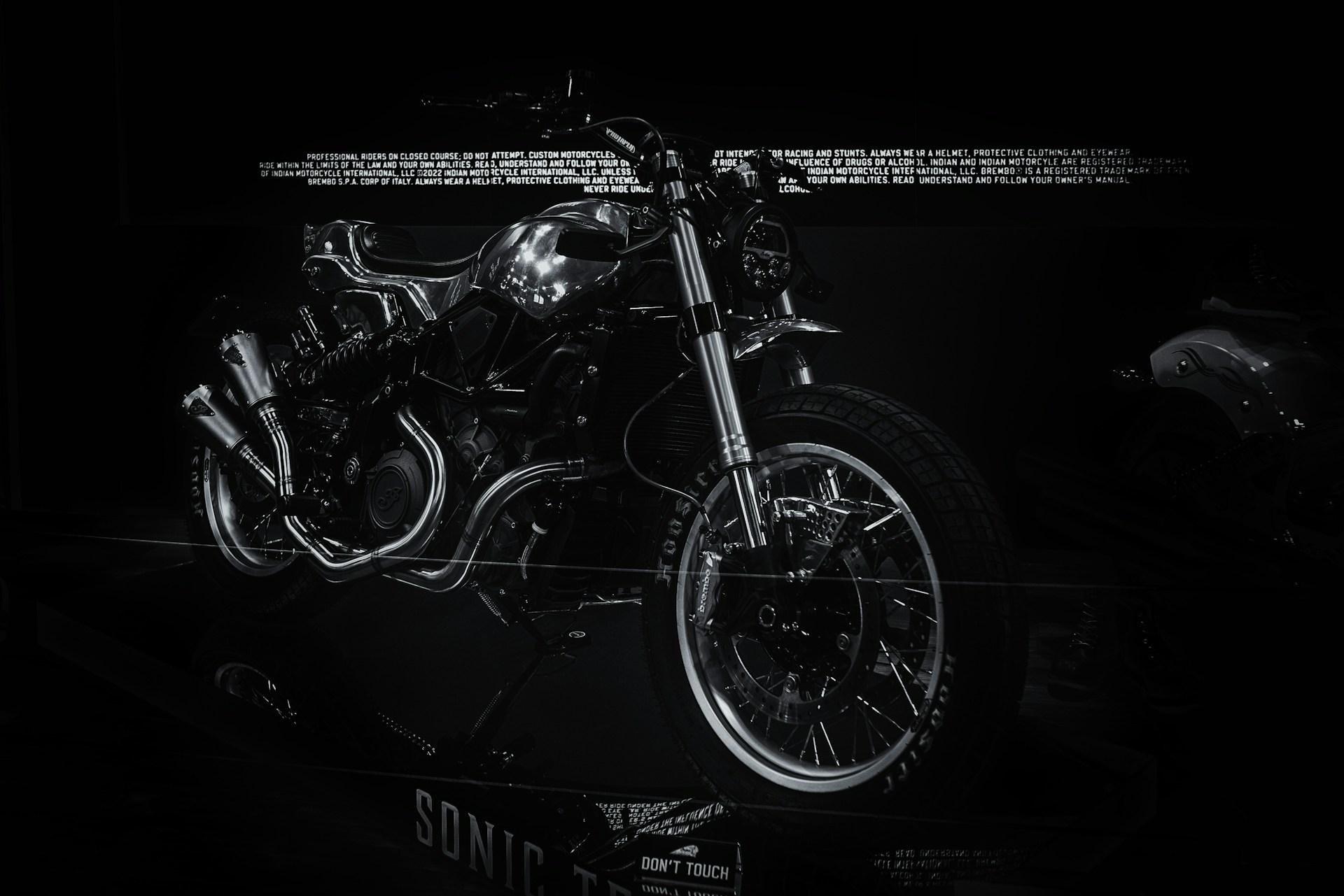 A dynamic scene showing a futuristic motorcycle design in motion, highlighted by neon accents.