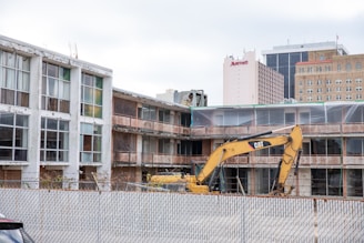 A construction site showing demolition work in progress.