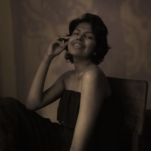 Portrait of Ralitsa Radeva, the osteoesthetic therapist, in a softly lit studio setting.