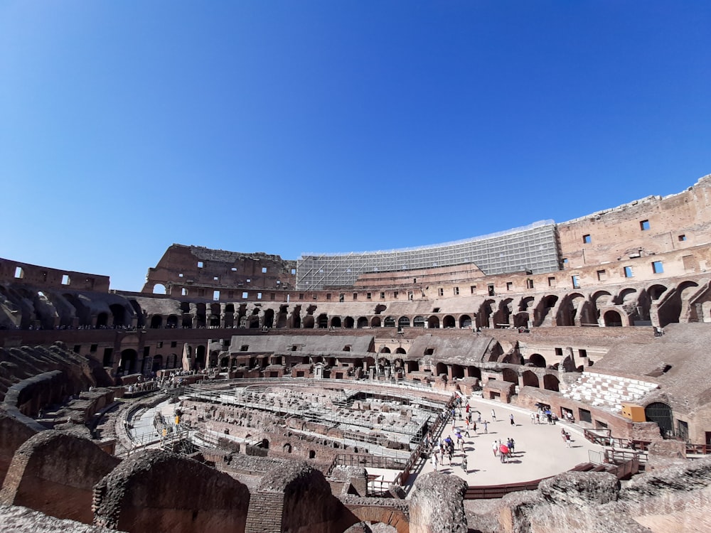 the inside of an ancient building with a sky background