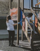 A group of volunteers working together to build a playground, embodying teamwork and care.