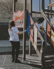 a woman climbing up a set of stairs