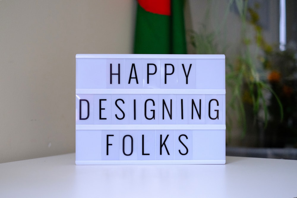 a light box that says happy designing folks