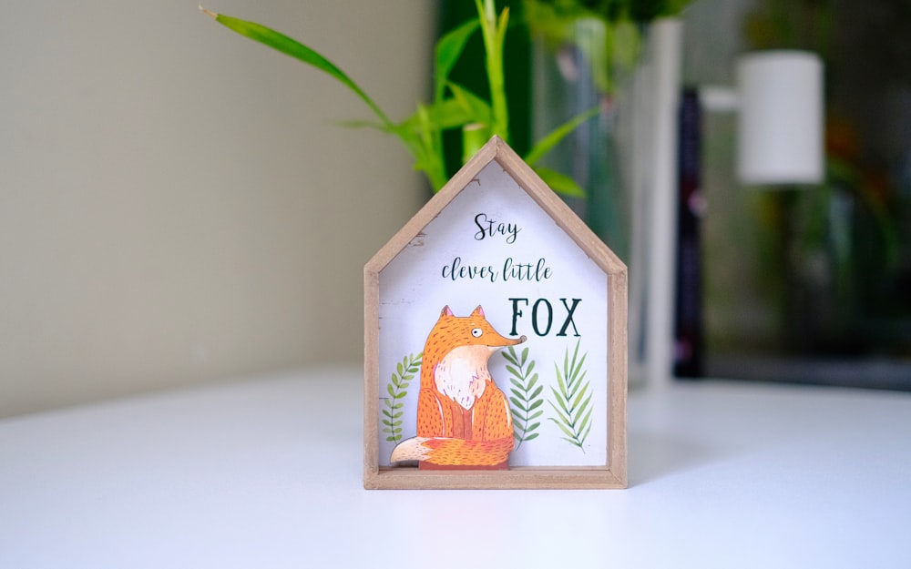 a picture of a house with a fox on it