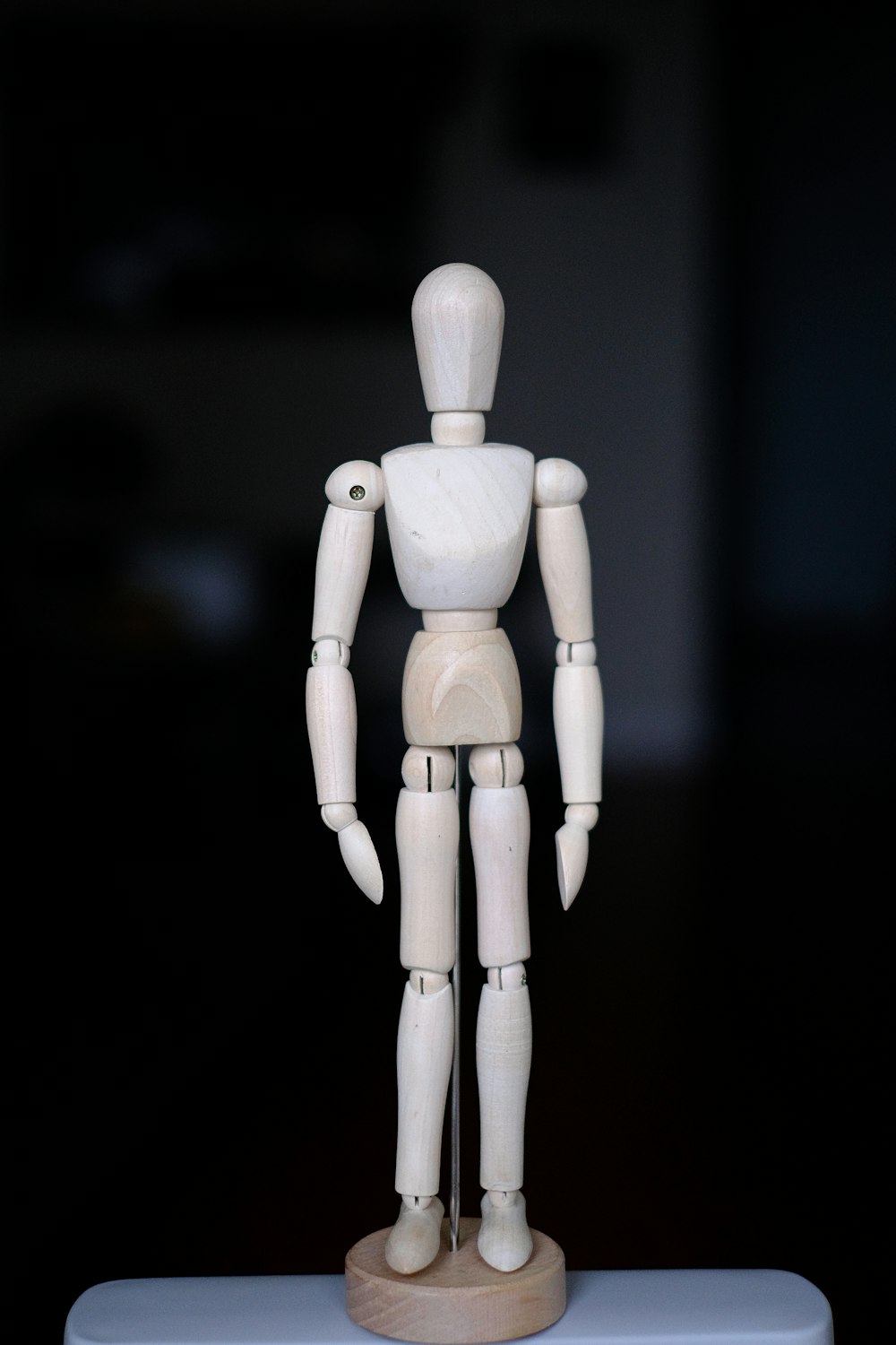 a wooden toy standing on top of a table