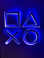 Puzzle game interface featuring glowing geometric shapes on a dark background.