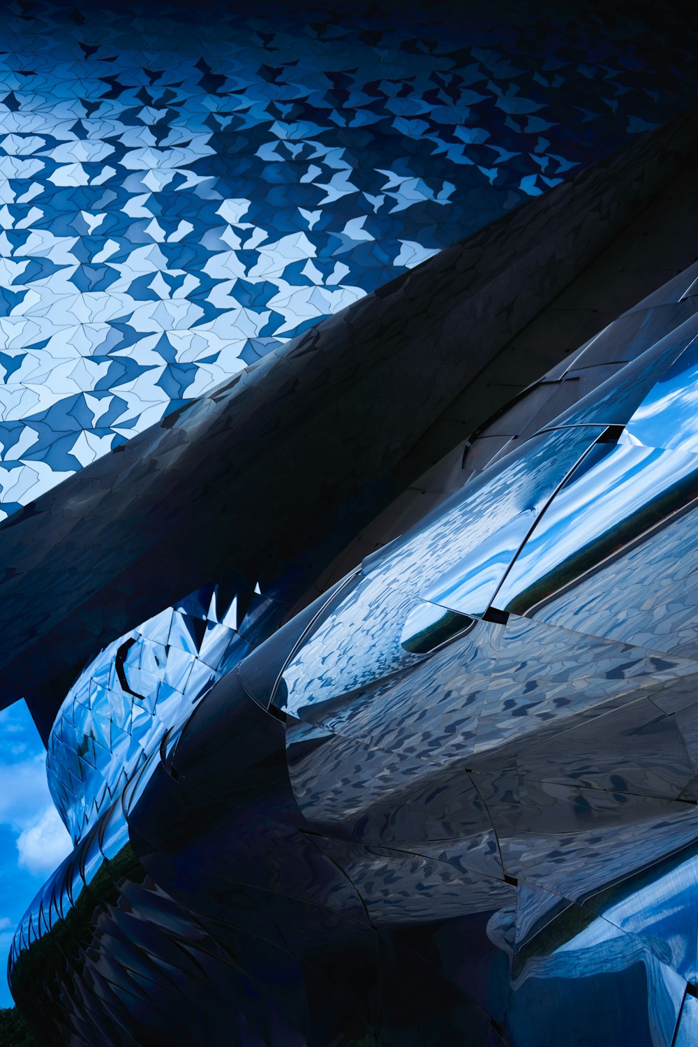 a close up of a plane wing with a sky in the background