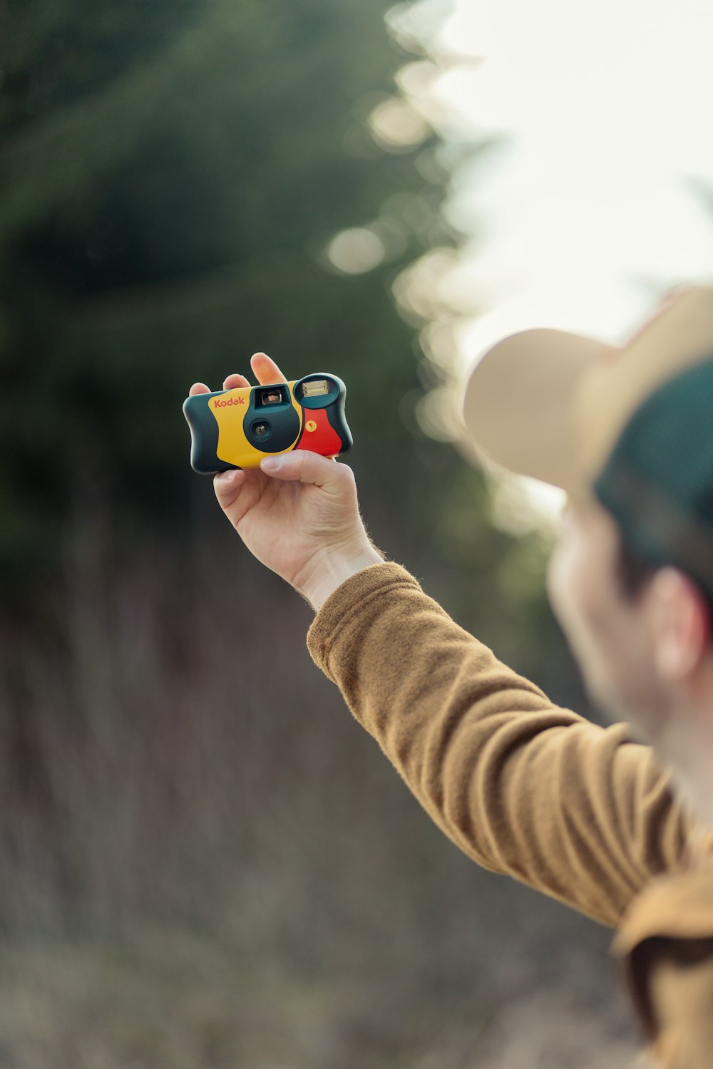 a person holding a small toy in their hand