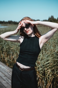 A person wearing a sleek UV-protective shirt outdoors on a sunny day.