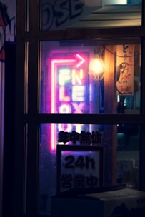 A glowing neon sign reading 'xxxflex.com' against a dark tech-inspired background.