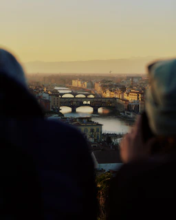 Sunset view of Dublin's cityscape with the River Liffey and iconic bridges.