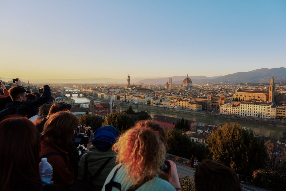 a group of people standing on top of a hill