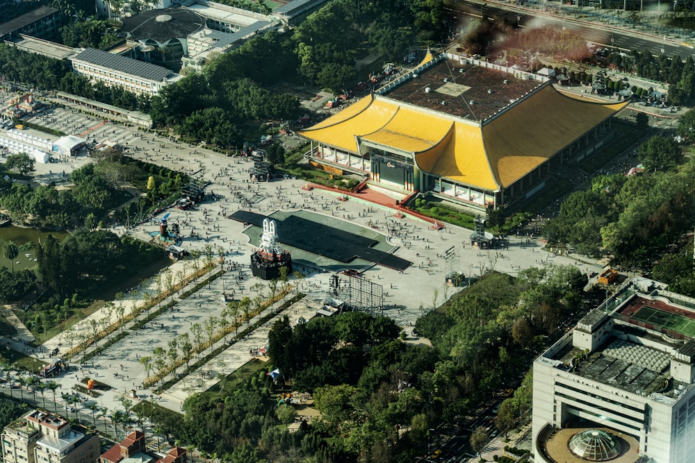 an aerial view of a building with a yellow roof