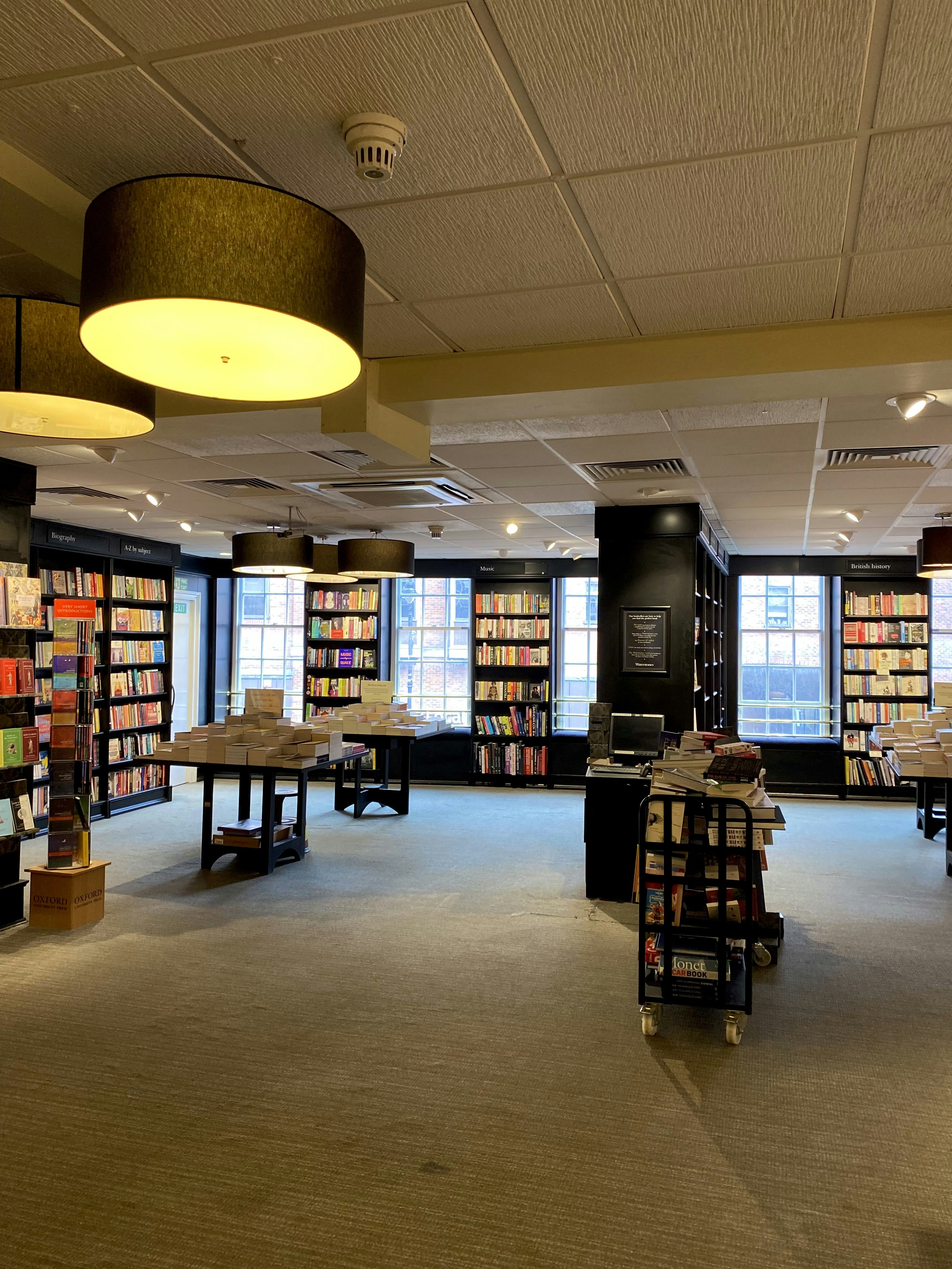 woman wearing yellow long-sleeved dress under white clouds and blue sky during daytime