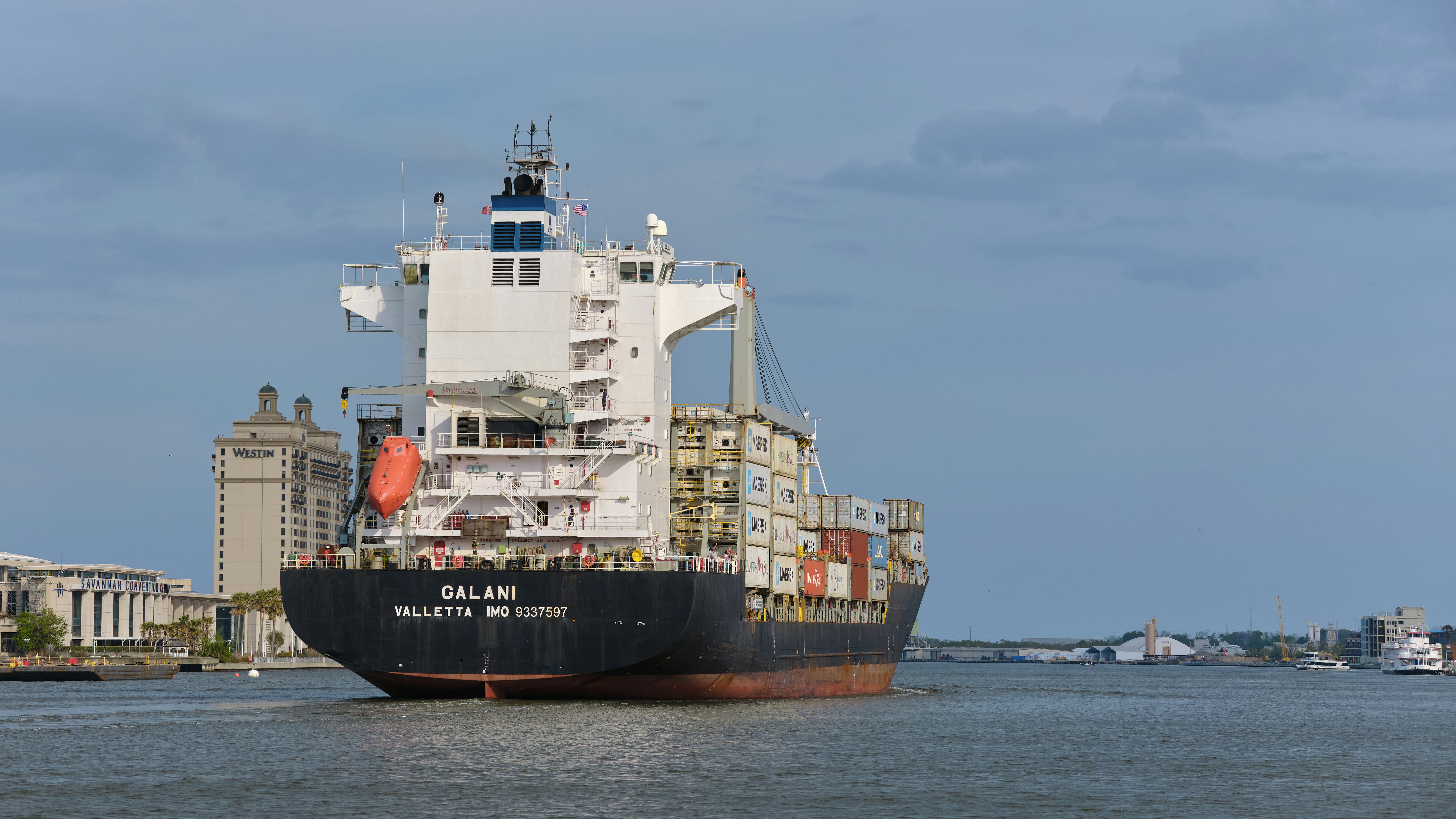 a large cargo ship in the middle of a body of water