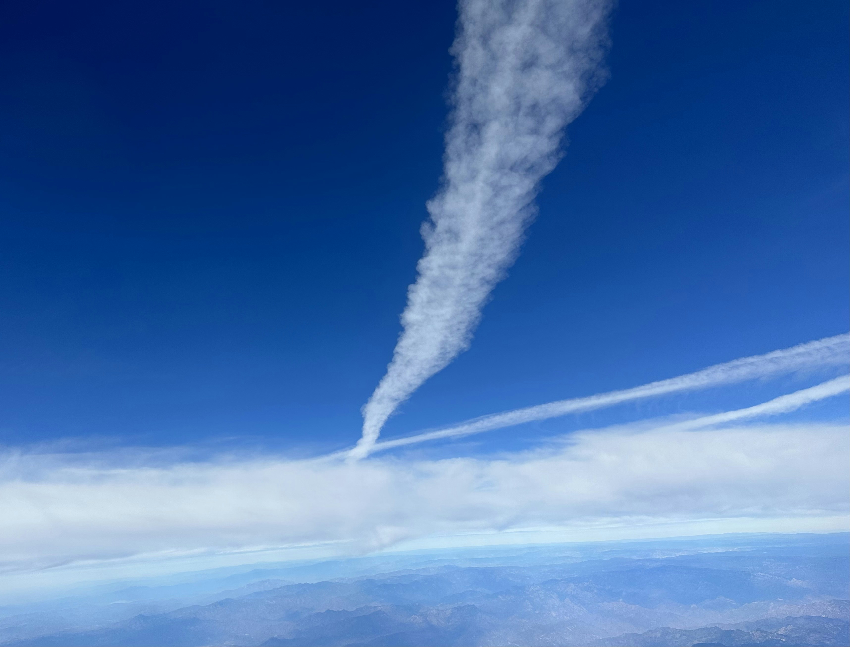 Waterspout mechanics and transport distances over 20 km - fish falls from sky
