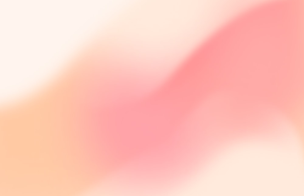 a blurry image of a pink and white background