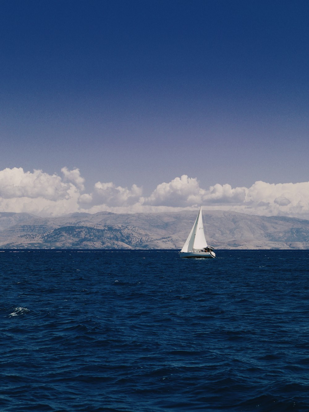 a sailboat in the middle of a large body of water